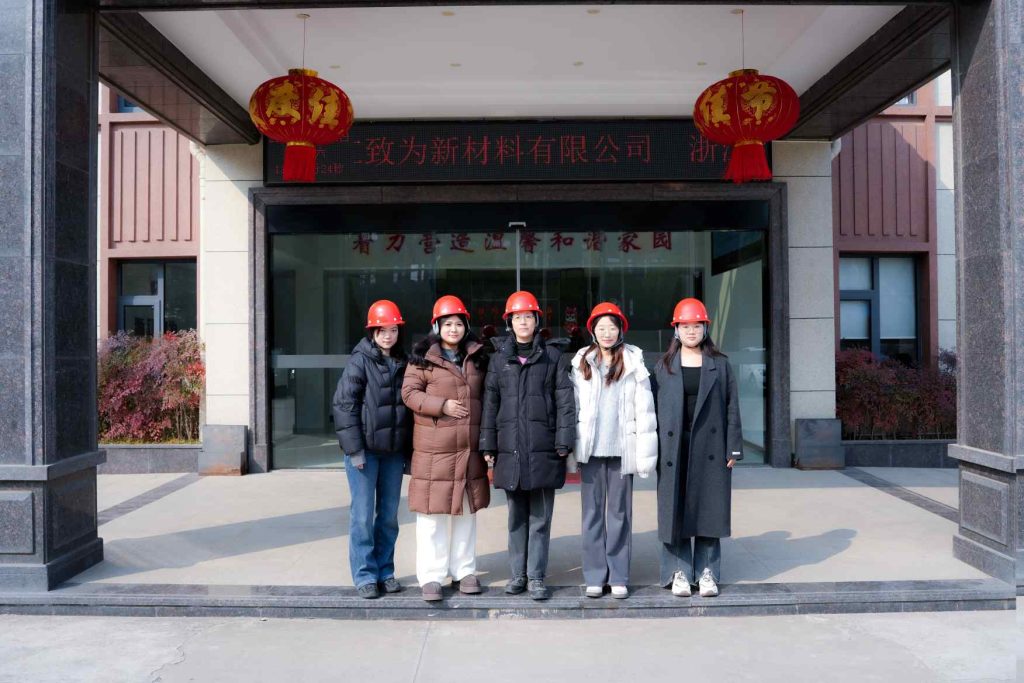 Zhiwei team standing at the company entrance.