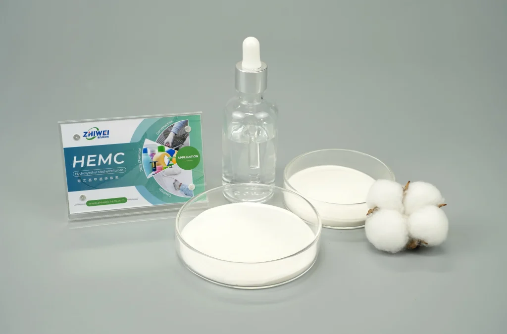 White HEMC powder in petri dishes next to a clear liquid solution bottle and raw cotton, showcasing Hydroxyethyl Methyl Cellulose applications in construction and coatings.